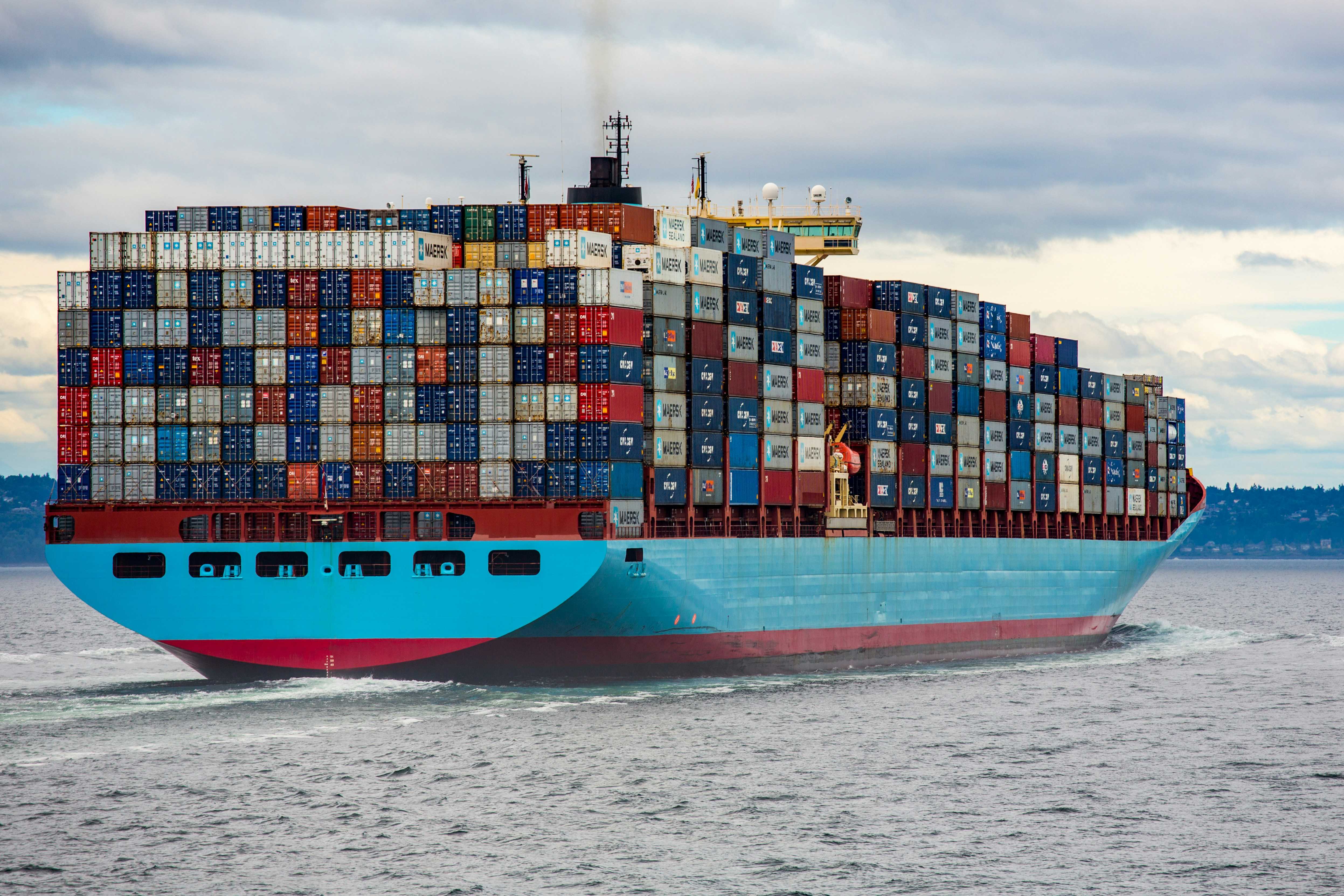 A cargo ship with containers stacked